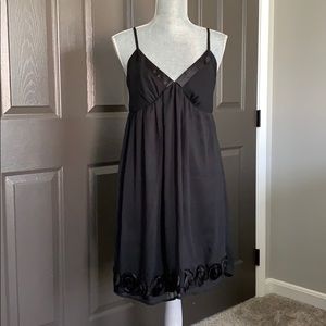 Medium little black dress with rosette detail